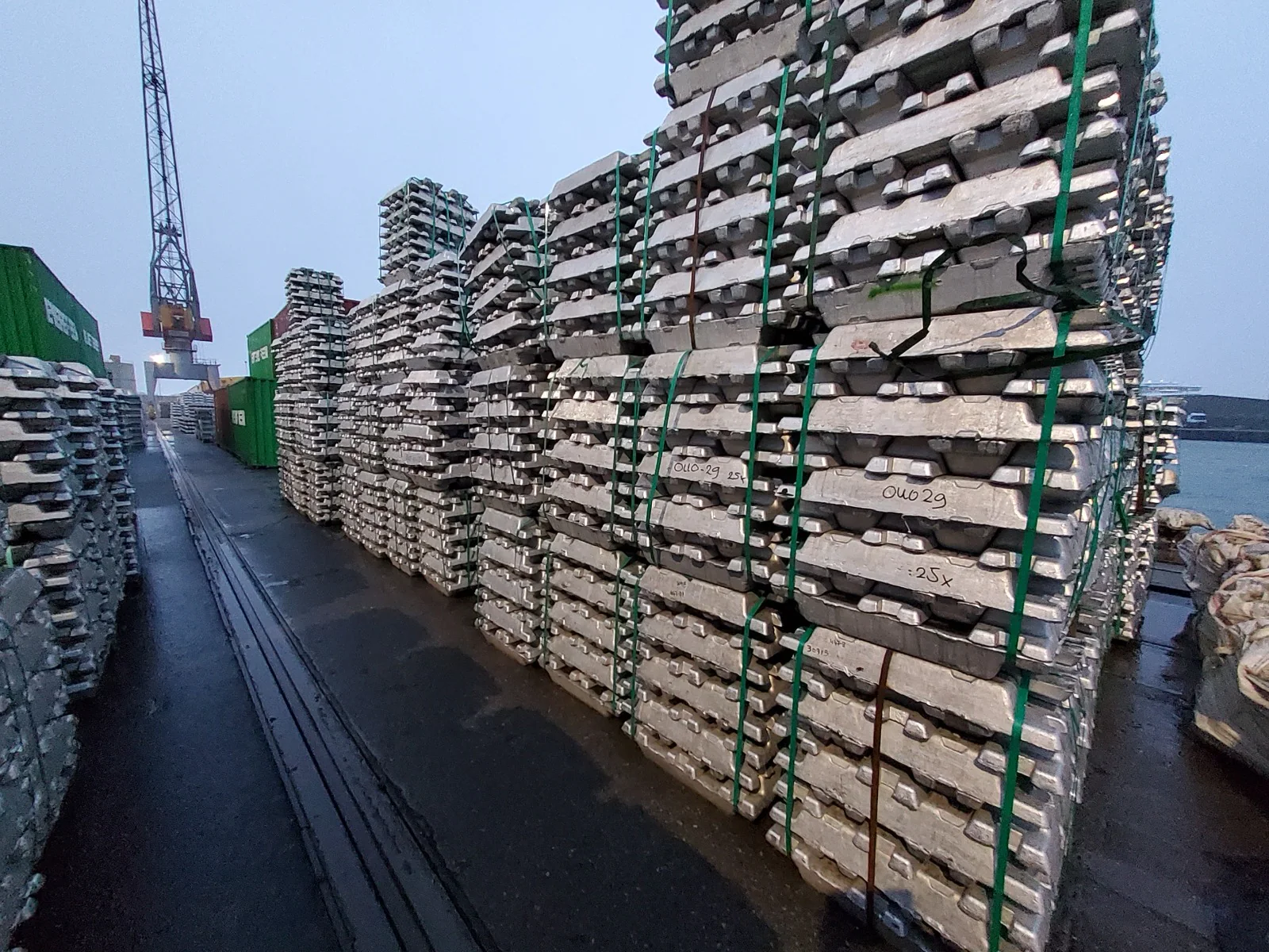 Bundled aluminium ingots arranged for stock inspection at a port