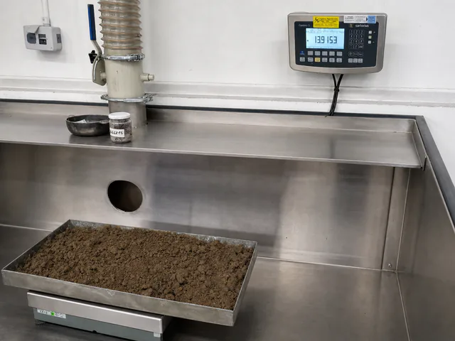 Material sample weighed in a metal tray during moisture determination
