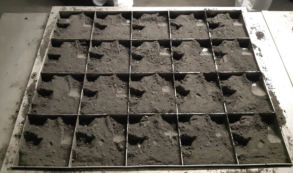 Lead concentrate sample arranged on a reduction grid